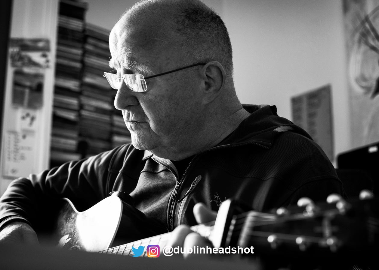 Christy Moore_Magic-Nights_portrait-with-guitar